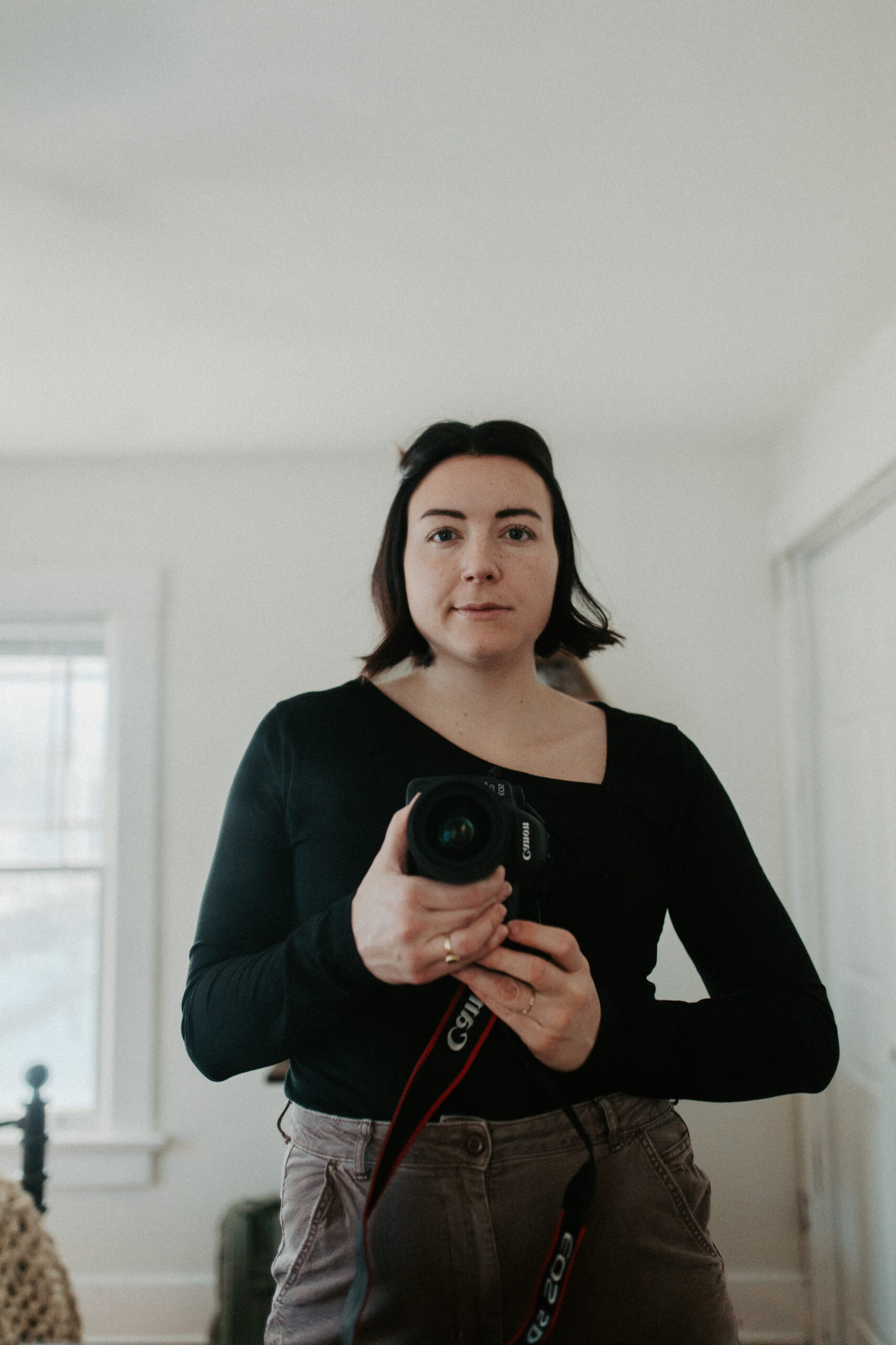 woman taking self-portrait in mirror